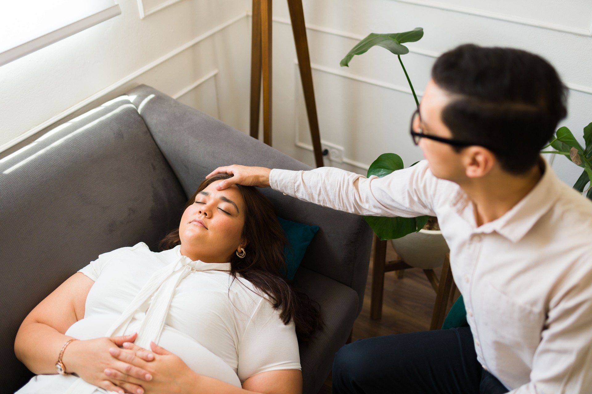 Therapist trying guided meditation with a patient
